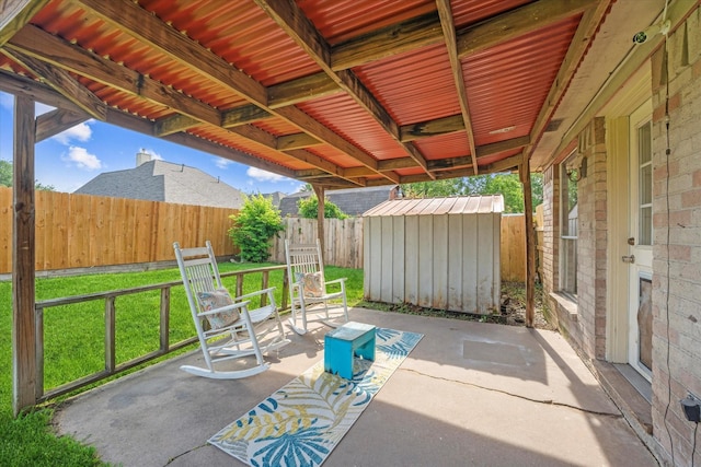 11731 Bexar Dr, La Porte, TX 77571 - fenced backyard with a storage shed and a patio area