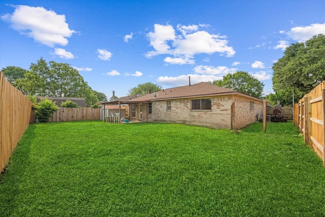 11731 Bexar Dr, La Porte, TX 77571 - rear view of property with brick siding and a fenced backyard