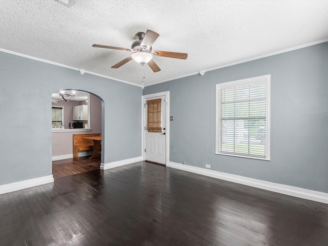 809 18th Ave N, Texas City, TX 77590 - empty room featuring arched walkways, ceiling fan, wood finished floors, a textured ceiling, and ornamental molding