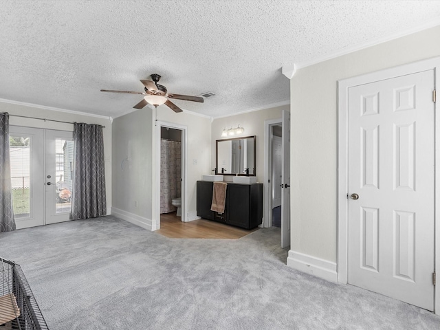 809 18th Ave N, Texas City, TX 77590 - unfurnished bedroom with ornamental molding, access to exterior, carpet, french doors, and baseboards