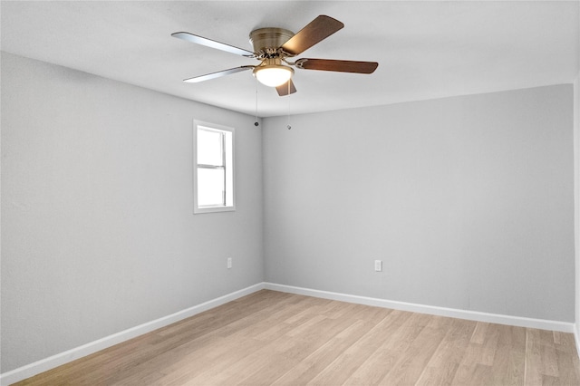 10118 Norvic St, Houston, TX 77029 - empty room with light wood-style flooring, baseboards, and a ceiling fan