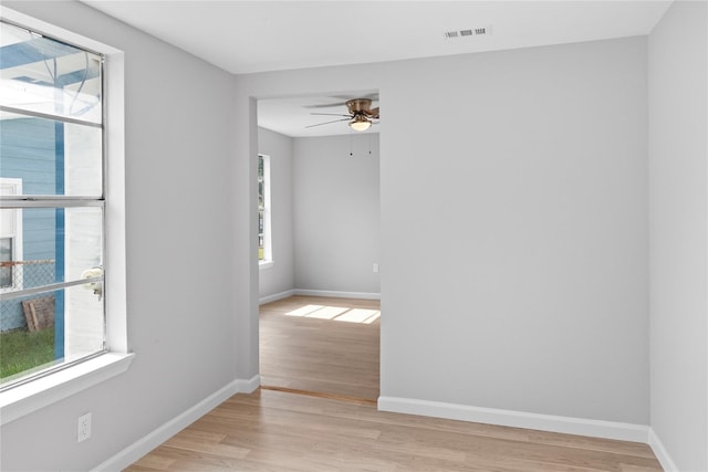 10118 Norvic St, Houston, TX 77029 - spare room with a ceiling fan, light wood finished floors, and baseboards