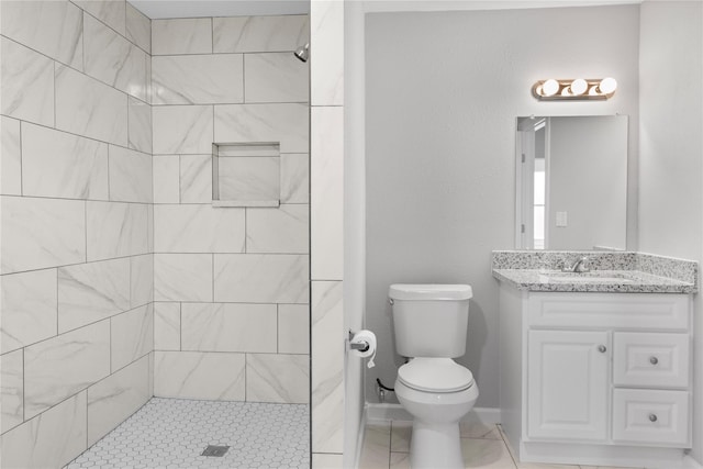 10118 Norvic St, Houston, TX 77029 - full bath featuring toilet, tiled shower, vanity, and tile patterned floors