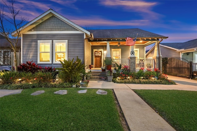 823 E 27th St, Houston, TX 77009 - craftsman house featuring covered porch, a yard, ceiling fan, and a gate