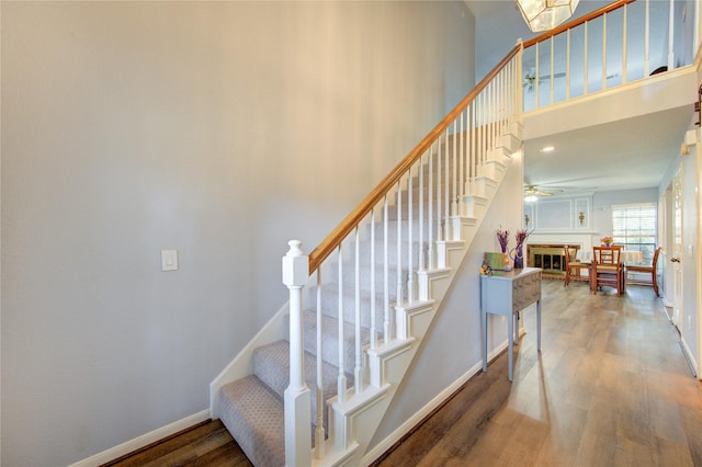 3402 Deeds Rd, Houston, TX 77084 - staircase with wood finished floors, baseboards, and ceiling fan