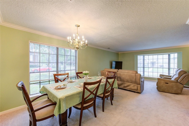 3402 Deeds Rd, Houston, TX 77084 - dining space with a chandelier, light carpet, a textured ceiling, and ornamental molding