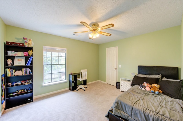 3402 Deeds Rd, Houston, TX 77084 - bedroom with carpet floors, baseboards, a ceiling fan, and a textured ceiling
