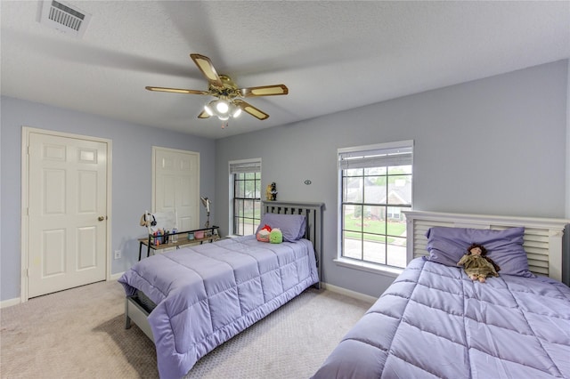 3402 Deeds Rd, Houston, TX 77084 - bedroom with carpet floors, baseboards, and a ceiling fan