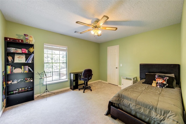 3402 Deeds Rd, Houston, TX 77084 - carpeted bedroom with baseboards, a ceiling fan, and a textured ceiling