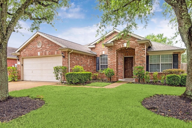 21551 Elm Hurst Ln, Katy, TX 77450 - view of front of property with brick siding, roof with shingles, an attached garage, a front lawn, and driveway