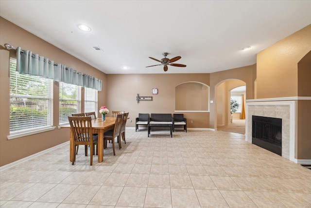 21551 Elm Hurst Ln, Katy, TX 77450 - dining room featuring ceiling fan, plenty of natural light, arched walkways, baseboards, and recessed lighting