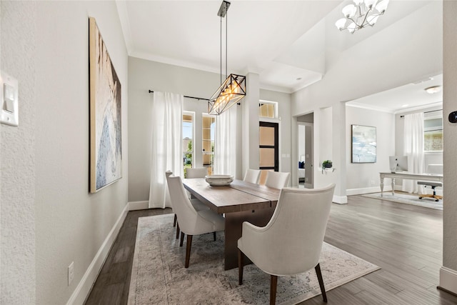 19307 Spillway Overlook Cir, Cypress, TX 77433 - dining area featuring a chandelier, wood finished floors, healthy amount of natural light, and crown molding