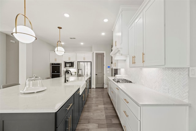 19307 Spillway Overlook Cir, Cypress, TX 77433 - kitchen with white cabinets, backsplash, wood finished floors, and recessed lighting