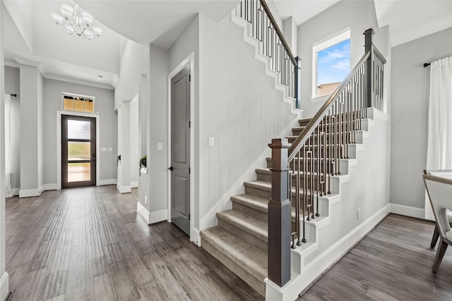 19307 Spillway Overlook Cir, Cypress, TX 77433 - staircase featuring healthy amount of natural light, wood finished floors, and a chandelier