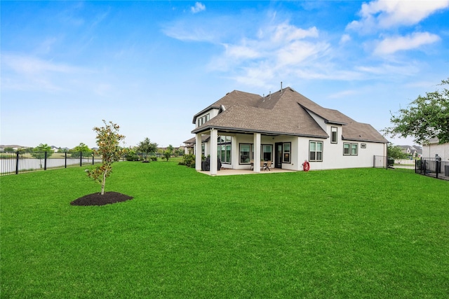 19307 Spillway Overlook Cir, Cypress, TX 77433 - rear view of property featuring stucco siding, a shingled roof, a fenced backyard, and a patio