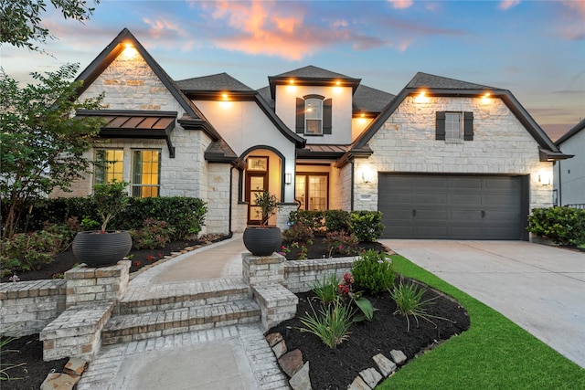 19307 Spillway Overlook Cir, Cypress, TX 77433 - french country style house with a standing seam roof, a metal roof, driveway, and stone siding