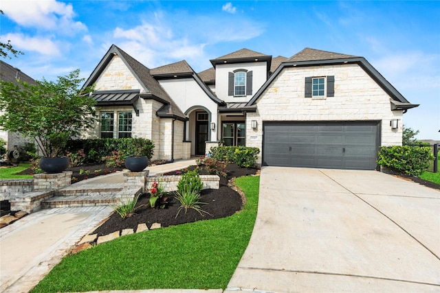 19307 Spillway Overlook Cir, Cypress, TX 77433 - french provincial home featuring a standing seam roof, a metal roof, and concrete driveway