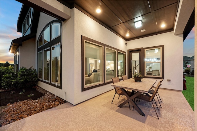 19307 Spillway Overlook Cir, Cypress, TX 77433 - patio terrace at dusk featuring a patio area and outdoor dining area