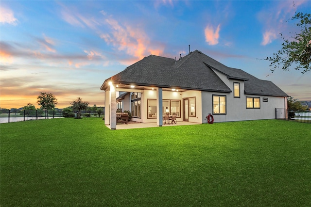 19307 Spillway Overlook Cir, Cypress, TX 77433 - back of house with a shingled roof, stucco siding, and a patio area