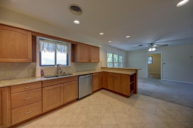 906 Carlee Dr, Brenham, TX 77833 - kitchen with dishwasher, a sink, light colored carpet, light stone counters, and recessed lighting
