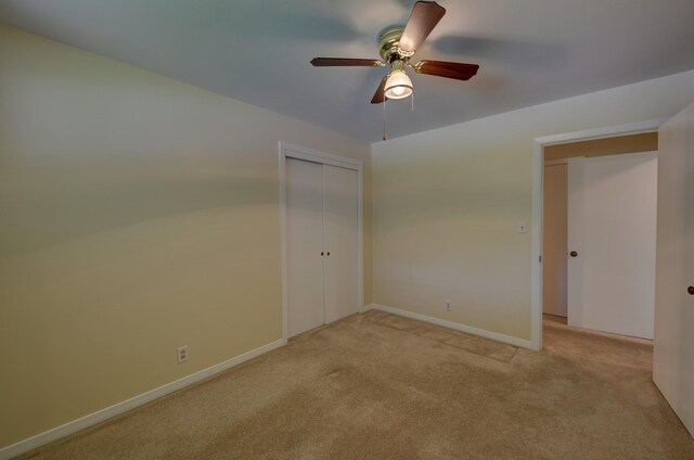 906 Carlee Dr, Brenham, TX 77833 - unfurnished bedroom with light carpet, a closet, baseboards, and ceiling fan