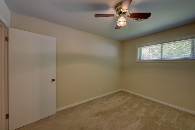 906 Carlee Dr, Brenham, TX 77833 - spare room featuring light carpet, baseboards, and ceiling fan
