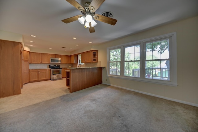 906 Carlee Dr, Brenham, TX 77833 - kitchen with appliances with stainless steel finishes, open shelves, plenty of natural light, baseboards, and recessed lighting