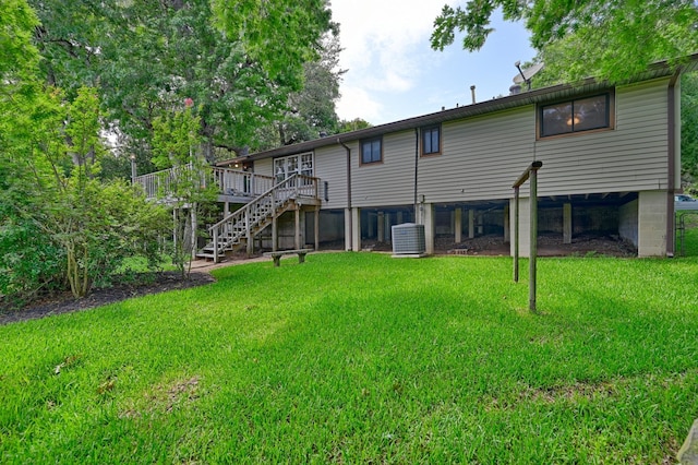 906 Carlee Dr, Brenham, TX 77833 - rear view of property featuring stairs, a wooden deck, a lawn, and cooling unit
