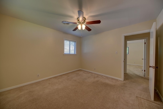 906 Carlee Dr, Brenham, TX 77833 - unfurnished room with light carpet, ceiling fan, and baseboards