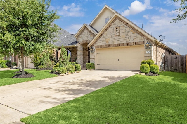 19726 Terrace Cliff Ct, Richmond, TX 77407 - french country inspired facade with driveway, an attached garage, stone siding, and roof with shingles