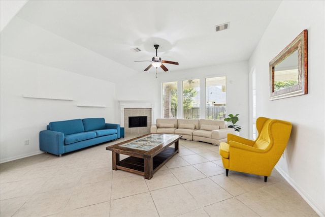 19726 Terrace Cliff Ct, Richmond, TX 77407 - living area featuring light tile patterned floors, baseboards, ceiling fan, and a tiled fireplace