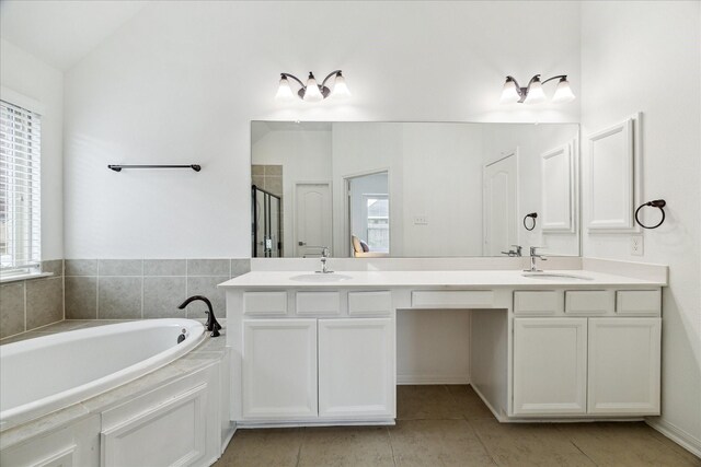 19726 Terrace Cliff Ct, Richmond, TX 77407 - full bathroom featuring a shower stall, a bath, double vanity, and tile patterned floors