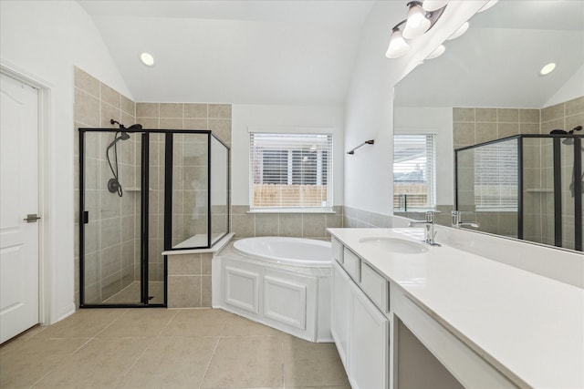 19726 Terrace Cliff Ct, Richmond, TX 77407 - bathroom featuring lofted ceiling, a garden tub, a stall shower, tile patterned floors, and recessed lighting