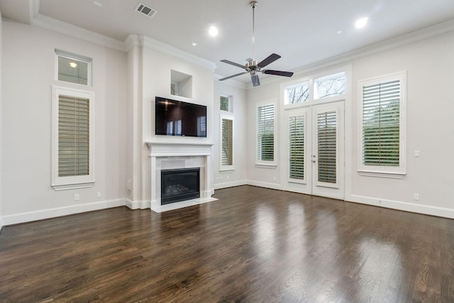 1811 Upland Lks, Houston, TX 77043 - unfurnished living room featuring a ceiling fan, dark wood-type flooring, ornamental molding, a glass covered fireplace, and baseboards