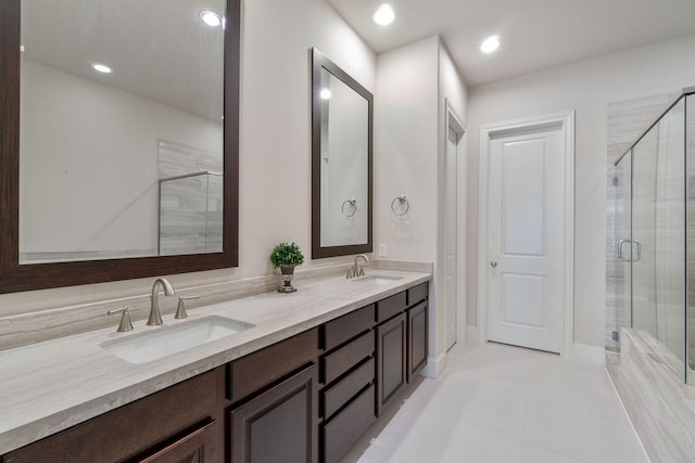 1811 Upland Lks, Houston, TX 77043 - full bath with double vanity, a stall shower, tile patterned flooring, and recessed lighting