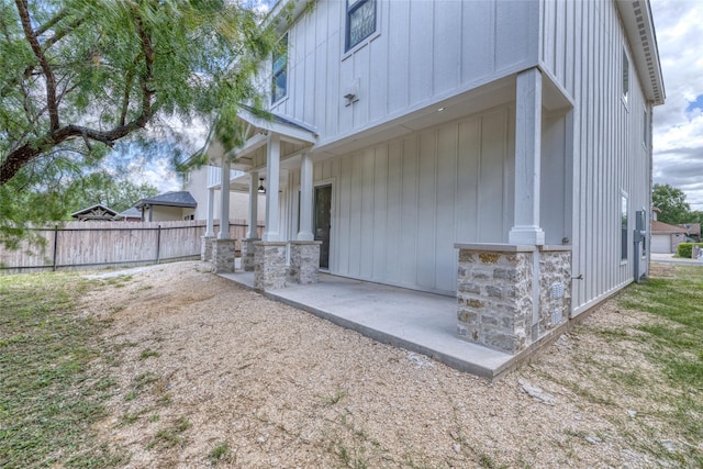 6 Rio Seco Dr, Uvalde, TX 78801 - rear view of property with a patio area and board and batten siding