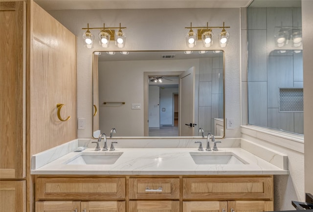 6 Rio Seco Dr, Uvalde, TX 78801 - full bath featuring double vanity and a ceiling fan