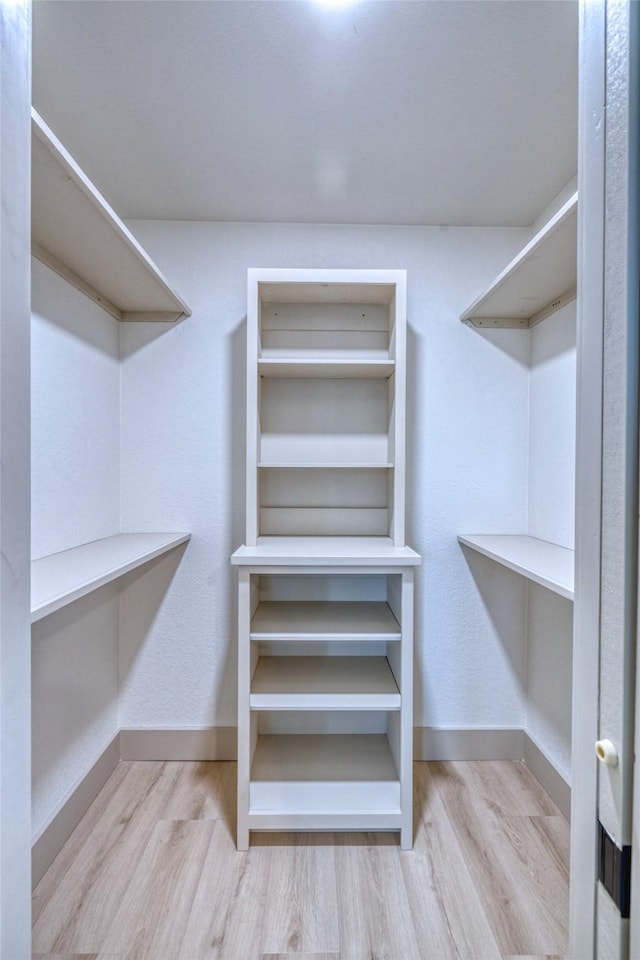 6 Rio Seco Dr, Uvalde, TX 78801 - walk in closet featuring wood finished floors
