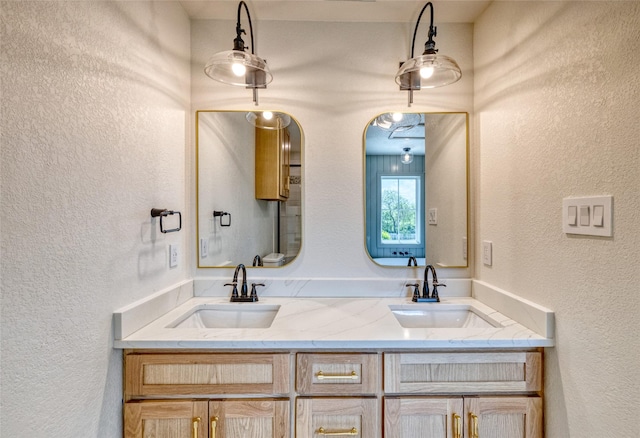 6 Rio Seco Dr, Uvalde, TX 78801 - bathroom with a textured wall and double vanity