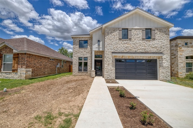 6 Rio Seco Dr, Uvalde, TX 78801 - contemporary home with stone siding, concrete driveway, a garage, and board and batten siding
