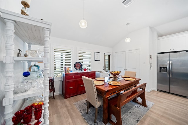 4236 Waterlily Spring Way, Porter, TX 77365 - dining area with vaulted ceiling, light wood-style floors, and baseboards