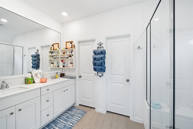 4236 Waterlily Spring Way, Porter, TX 77365 - full bath with a shower stall, double vanity, recessed lighting, and wood finished floors