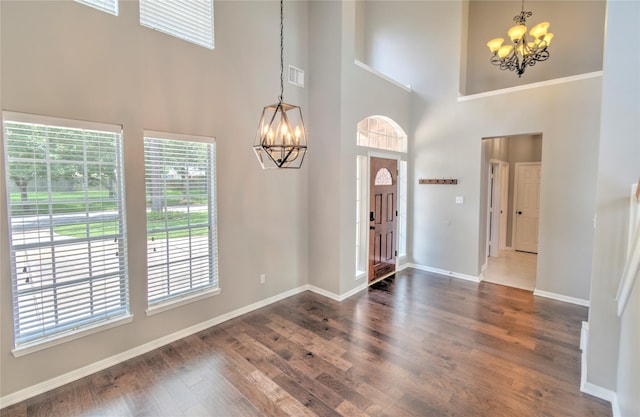19927 Maple Village Dr, Cypress, TX 77433 - entrance foyer featuring a chandelier, a towering ceiling, wood finished floors, and baseboards