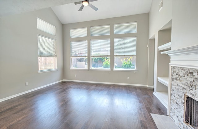 19927 Maple Village Dr, Cypress, TX 77433 - unfurnished living room with a fireplace, healthy amount of natural light, ceiling fan, lofted ceiling, and dark wood-style flooring