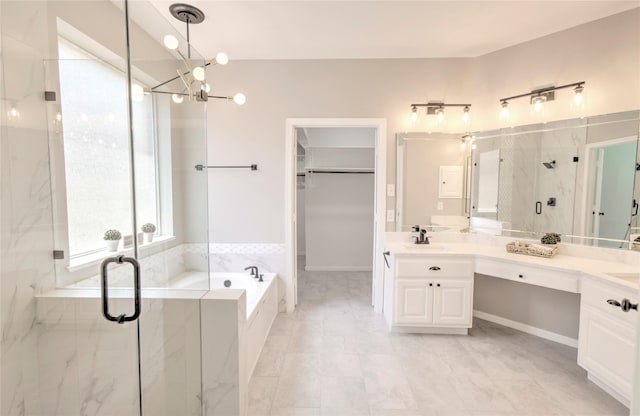 19927 Maple Village Dr, Cypress, TX 77433 - full bath with a marble finish shower, a bath, double vanity, and a chandelier