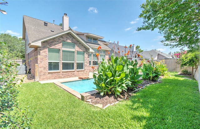 19927 Maple Village Dr, Cypress, TX 77433 - back of property featuring brick siding, a chimney, and roof with shingles