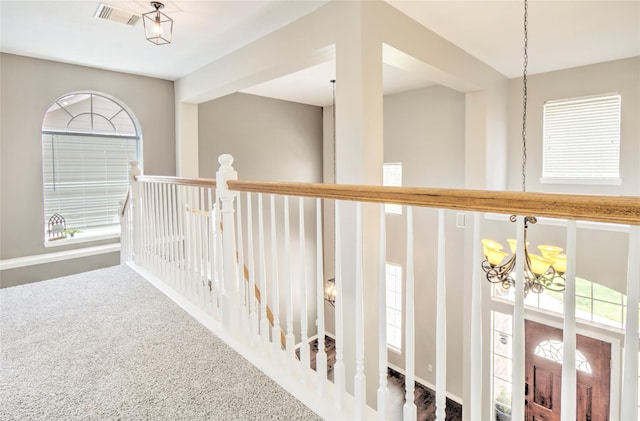 19927 Maple Village Dr, Cypress, TX 77433 - hallway with a chandelier, plenty of natural light, carpet flooring, and an upstairs landing