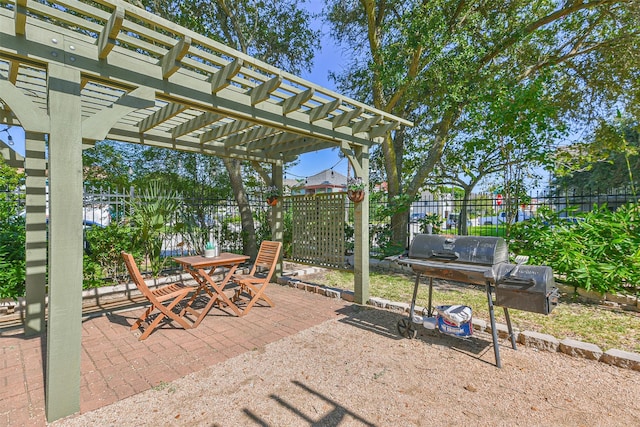 1513 19th St, Galveston, TX 77550 - view of patio featuring a pergola, outdoor dining area, and a grill