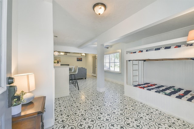 1513 19th St, Galveston, TX 77550 - bedroom with baseboards and bar area