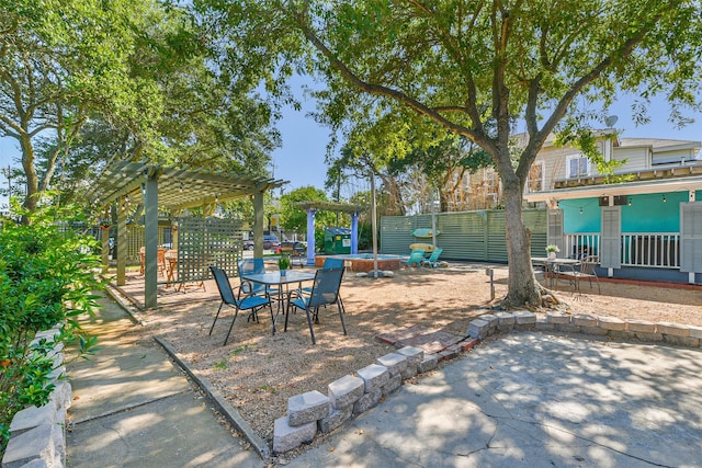 1513 19th St, Galveston, TX 77550 - view of patio / terrace featuring a pergola and outdoor dining area